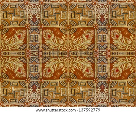 Ornamental textured background in orange and yellow tones.