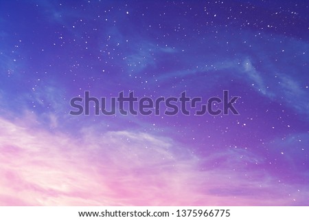 View on a evening purple sky with cirrus clouds and stars (background, abstract) Royalty-Free Stock Photo #1375966775