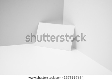 Design concept - perspective view of horizontal business card on white 3D space background for mockup, it's real photo, not 3D render