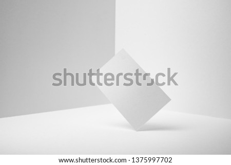 Design concept - perspective view of vertical business card on white 3D space background for mockup, it's real photo, not 3D render