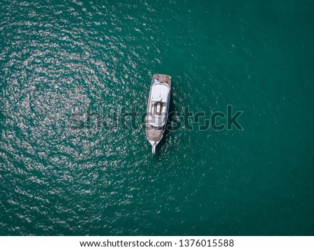 Aerial picture of an isolated yacht with brown wooden design in the sea. Andaman sea