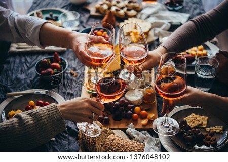 Glasses of rose wine seen during a friendly party of a celebration. Royalty-Free Stock Photo #1376048102