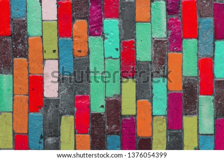 Multicolor brick wall with cross design.  Abstract colorful cement wall texture background .