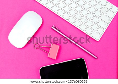 Stationery on vivid pink background. Flat lay