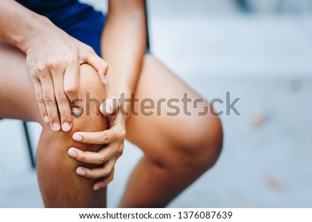 young women knee ache, healthcare concept Royalty-Free Stock Photo #1376087639