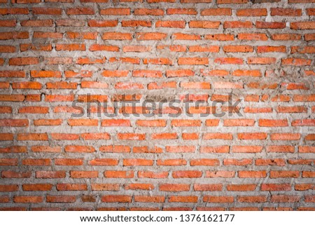 Red brick walls that use cement as fasteners. Popular in construction. Shows the surface and pattern. Suitable to use as a background image and graphic design.