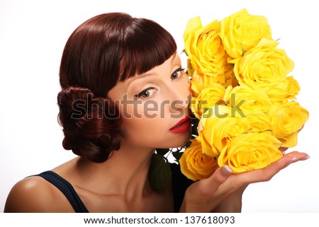 The girl with a bouquet of yellow roses