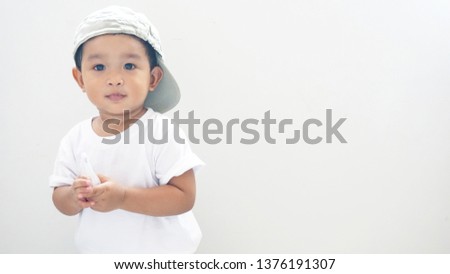 Asian kid want to touch Thermometer. 