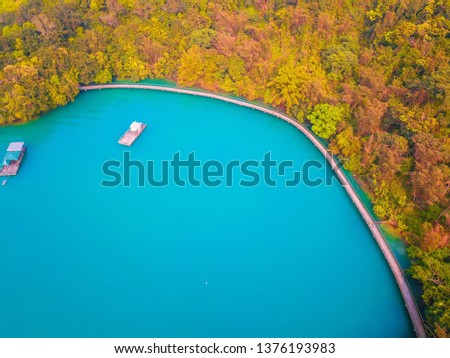 Aerial Drone Photography top view bike trail amid nature at sun moon lake in Taiwan.
