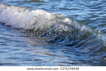 Waves on the seashore as an abstract background .