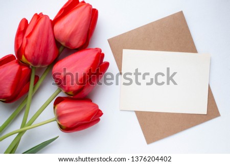 Minimalistic card mockup with red tulips, flower, craft envelope, blossom, flat lay, top view