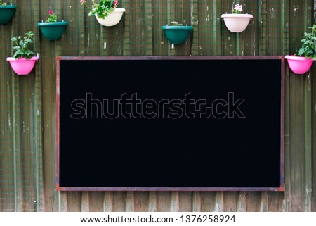 black chalkboard mockup menu and message template on the cafe background