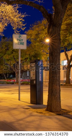street parking kiosk pay here long exposure in Pasadena Ca on Lake Avenue
