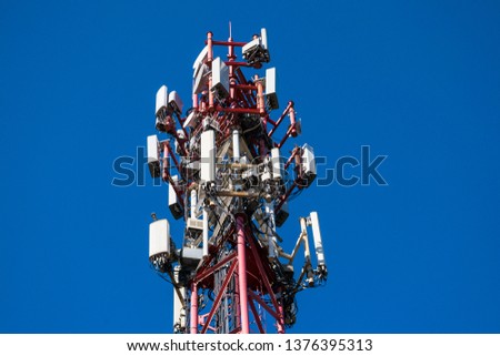 A fragment of a cell tower close-up against the blue sky.Modern telecommunication equipment.4G networks