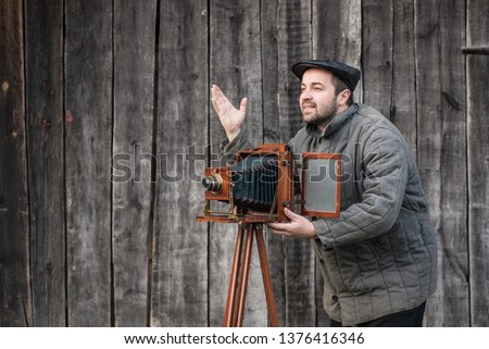 Photographer works with large format camera, retro style. Concept - photography of the 1930s-1950s