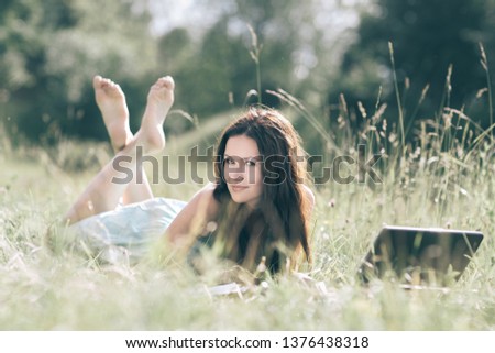 modern cute girl relaxarea on the fresh grass.