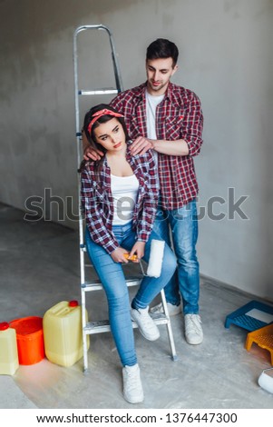 Wife and husband family doing home improvements,man doing massage for him girl!