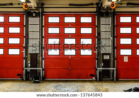 Red Fire Station doors closed at a fire station in England, UK Royalty-Free Stock Photo #137645843