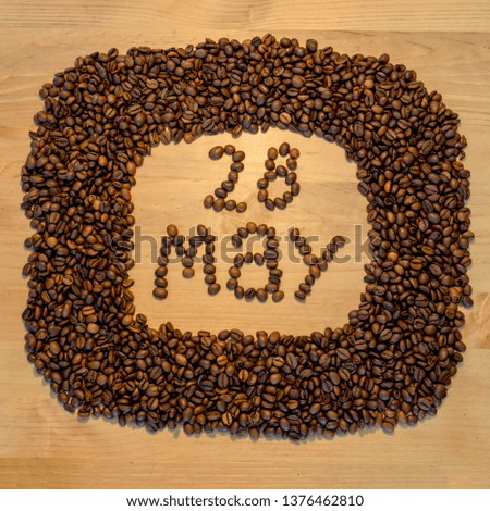 May 28, may calendar of coffee beans on wooden background