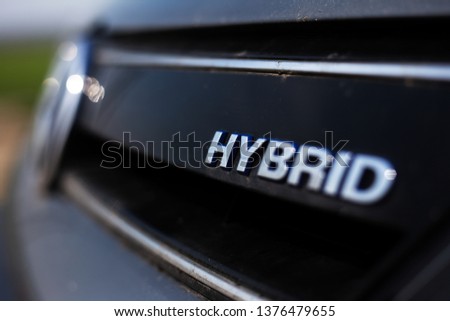 Close-up of hybrid, ecologic car symbol 