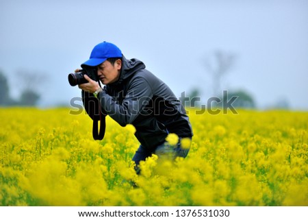 Happy photo shoot in yellow flower field