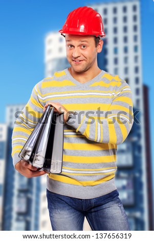Image of cute hardworker with a few folders