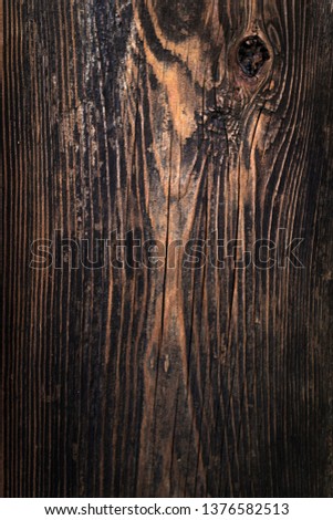 close up dark old vintage wood from tree as a background. the wood texture is clear. the color of the wood is dark tone