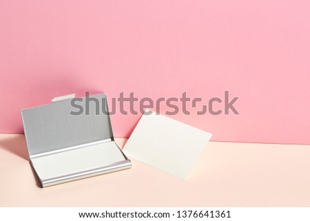 Blank business card on colorful background