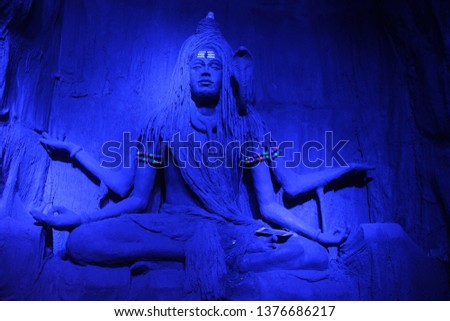 Mesmerising sculpture of Lord Shiva meditating in a blue light during Ganpati Festival, Pune.