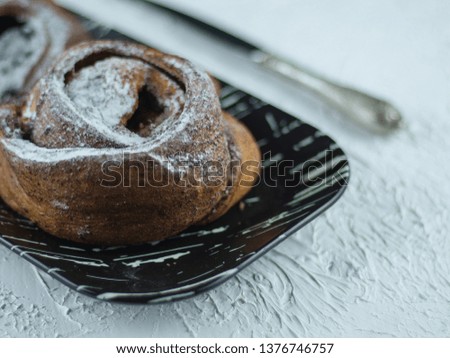 Sweet buns on a light stone background