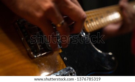 recording music audio for guitarist in studio Royalty-Free Stock Photo #1376785319