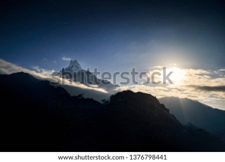 Snowy Machapuchare Fish Tale mountain at night starry sky in Annapurna sanctuary of Nepal 