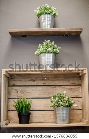 Close-up background of interior decoration items (coffee, bakery, restaurant) with vases, wooden tables, bookshelves, to be a corner for customers to sit and relax or take pictures while in use.