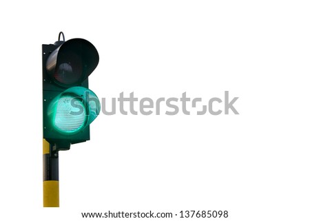 A green traffic light, slightly angled to the right, isolated on a white background. Suggesting receiving the go ahead, getting permission...