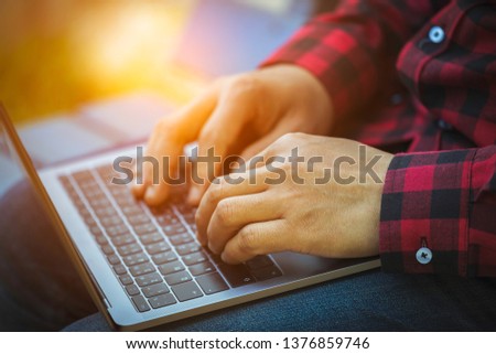 Man working with laptop to work in nature in a day