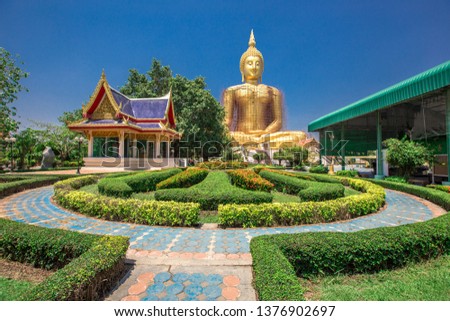 Large Buddha image background (Wat Muang) can be seen from the streets and surrounding areas, tourists prefer to make merit and take pictures without permission in Ang Thong Province, Thailand