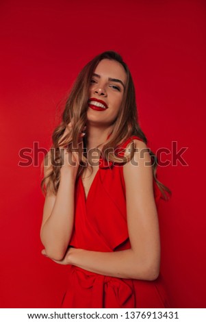 Amazing caucasian girl with long light-brown hair posing with smile. 