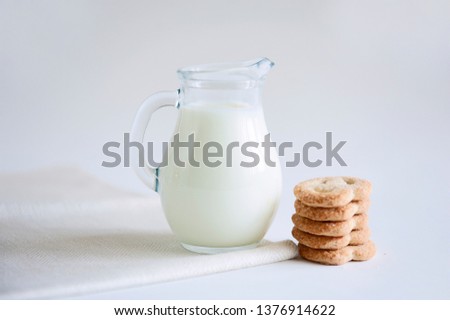 Milk and cookies on the white background