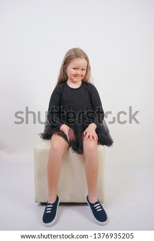 cute baby girl with long hair on white background in Studio