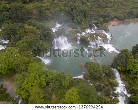 Ban Gioc waterfall or Detian waterfall is a collective name for two waterfalls in border Cao Bang, Vietnam and Daxin County, China. Royalty high-quality free stock photo image of a beautiful waterfall
