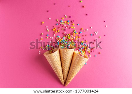 Ice cream cornets with colored sugar pearl