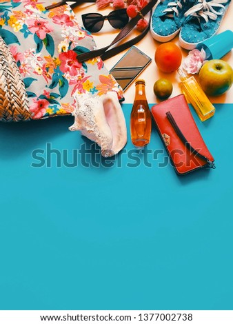  Women's clothes accessories  summer holiday beach leisuare seashell  relax  travel seashell sunglasses smartphone sandals apple  orange red colorful  blue background concept abstract   copy space 
