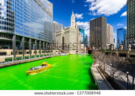 Chicago Skylines building along green dyeing river of Chicago River on St. Patrick's day festival in Chicago Downtown IL USA Royalty-Free Stock Photo #1377008948