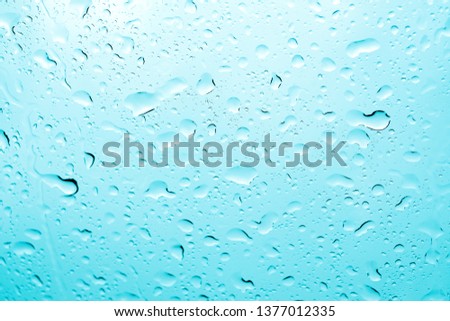 Picture Inside of water rain drops on car window glass 