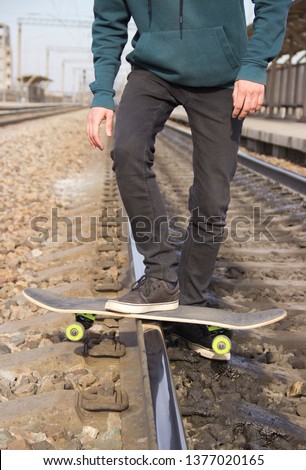 drift on a skateboard on the railway rail