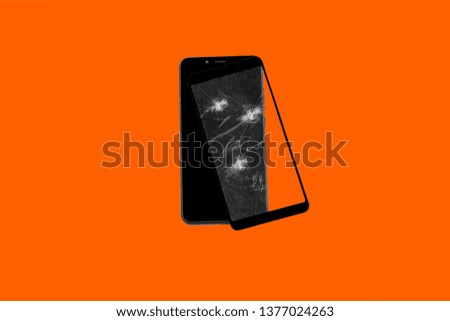 smartphone with broken protection glass screen on colored background isolated
