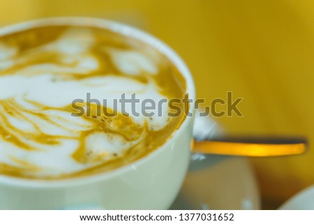 Cup of cappuccino. Texture of milk foam on a coffee drink. Drawing on coffee. Flat White. Cappuccino in a white Cup.