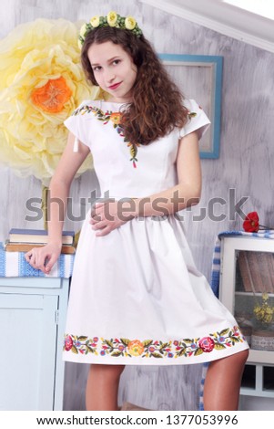 Beautiful teen girl in national dress. captured in studio