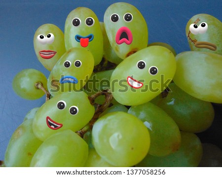 Grapes with eyes and mouth. Funny character and smiling faces.