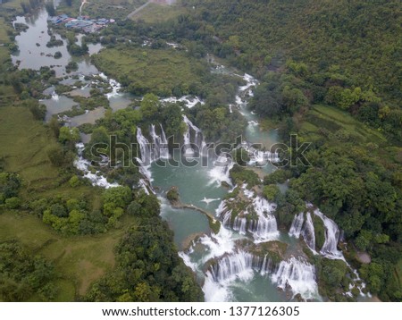 Ban Gioc waterfall or Detian waterfall is a collective name for two waterfalls in border Cao Bang, Vietnam and Daxin County, China. Royalty high-quality free stock photo image of a beautiful waterfall